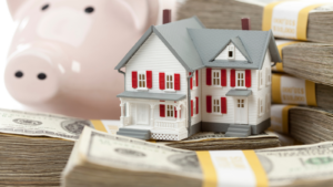 Small House and Piggy Bank with Stacks Money