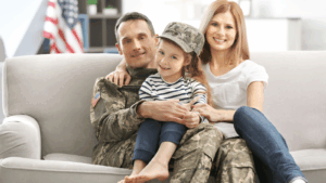 US Veteran sitting with his family on the couch