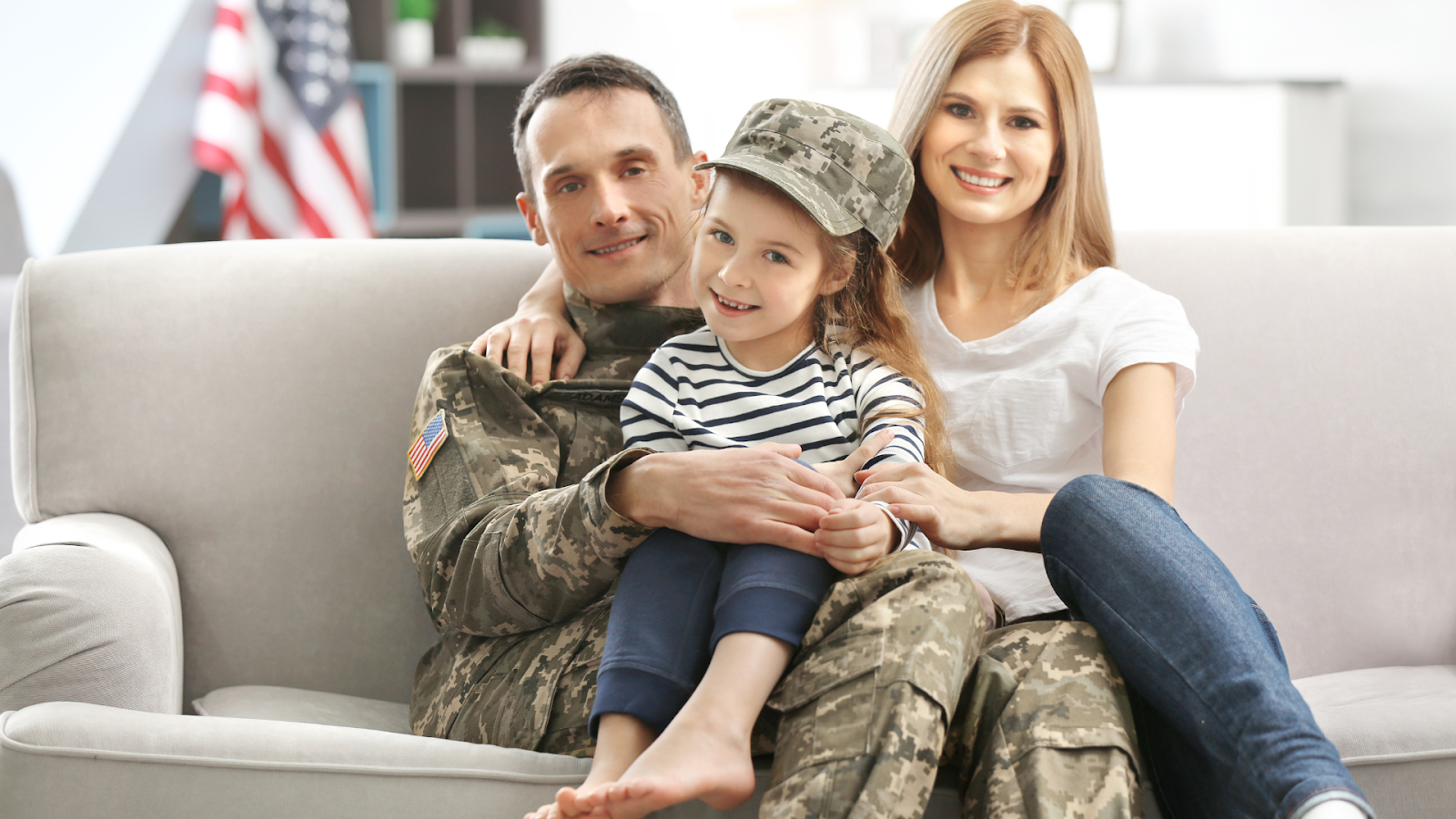US Veteran sitting with his family on the couch