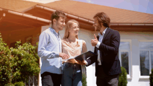 Homeowners conversing with an assessor outside their home