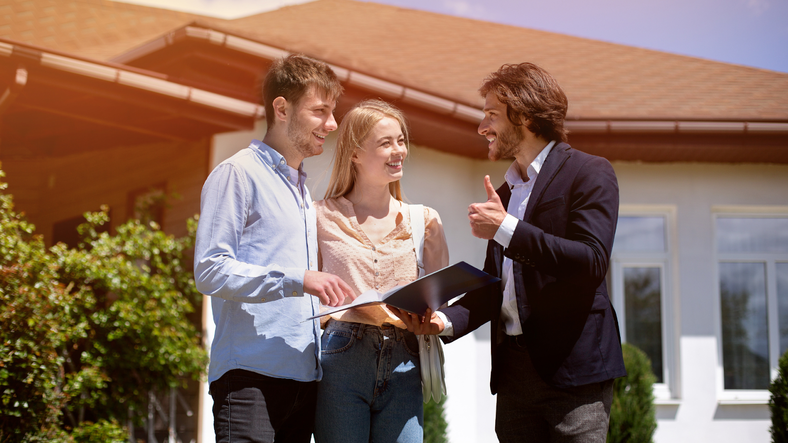 Homeowners conversing with an assessor outside their home