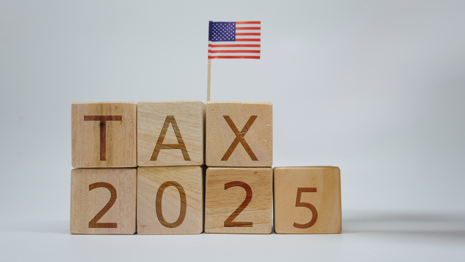 Wooden blocks representing 2025 tax with US flag
